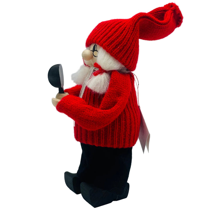 Swedish tomtelady holding a mirror