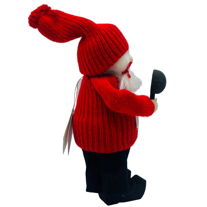 Swedish tomtelady holding a mirror