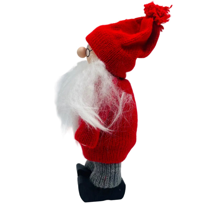 Swedish tomte man holding a straw heart