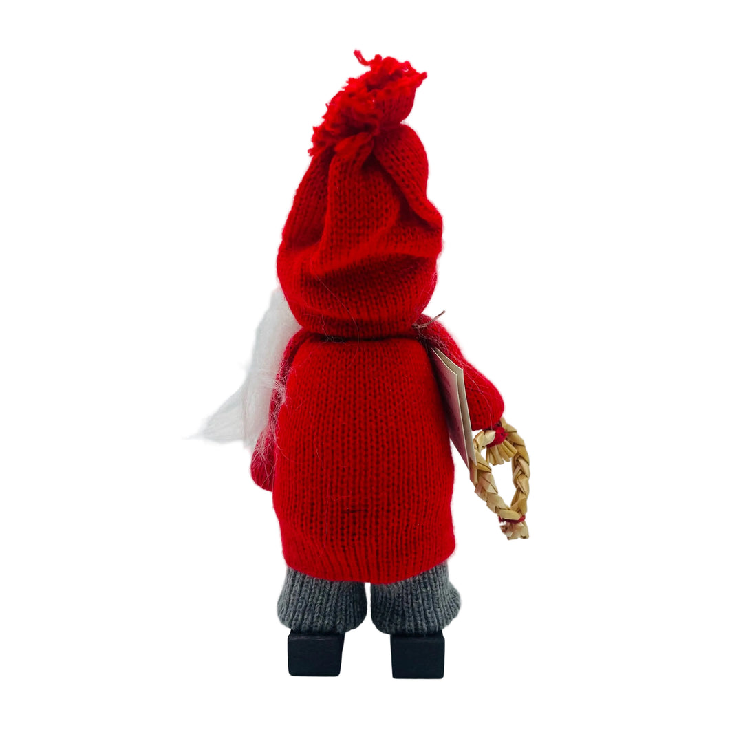 Swedish tomte man holding a straw heart