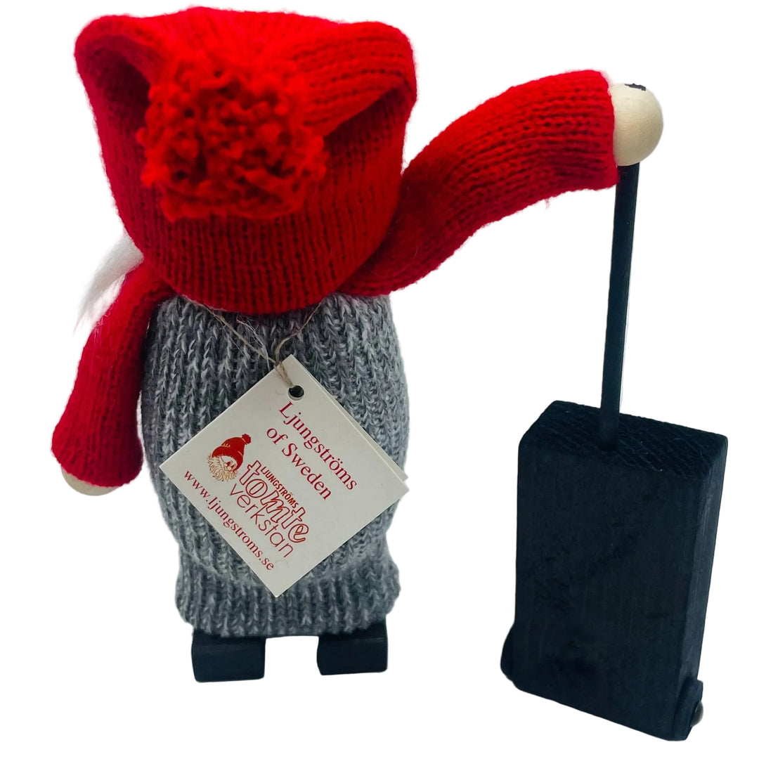 Swedish tomte lady with suitcase