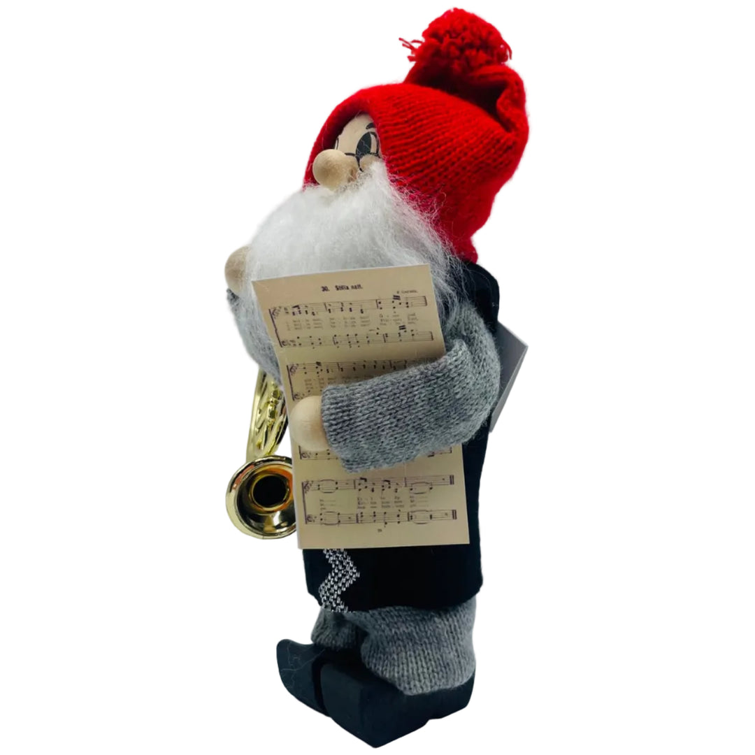 Swedish tomte with French horn and sheet of music