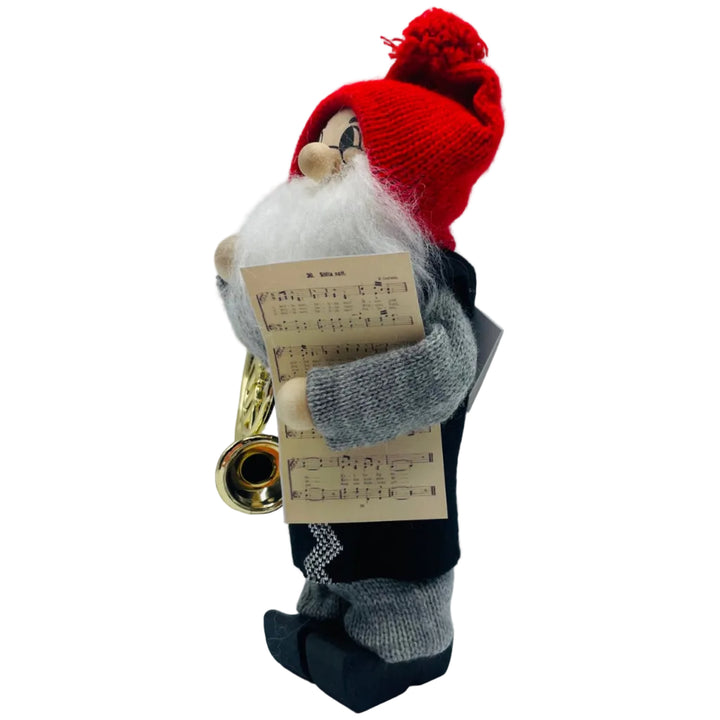 Swedish tomte with French horn and sheet of music