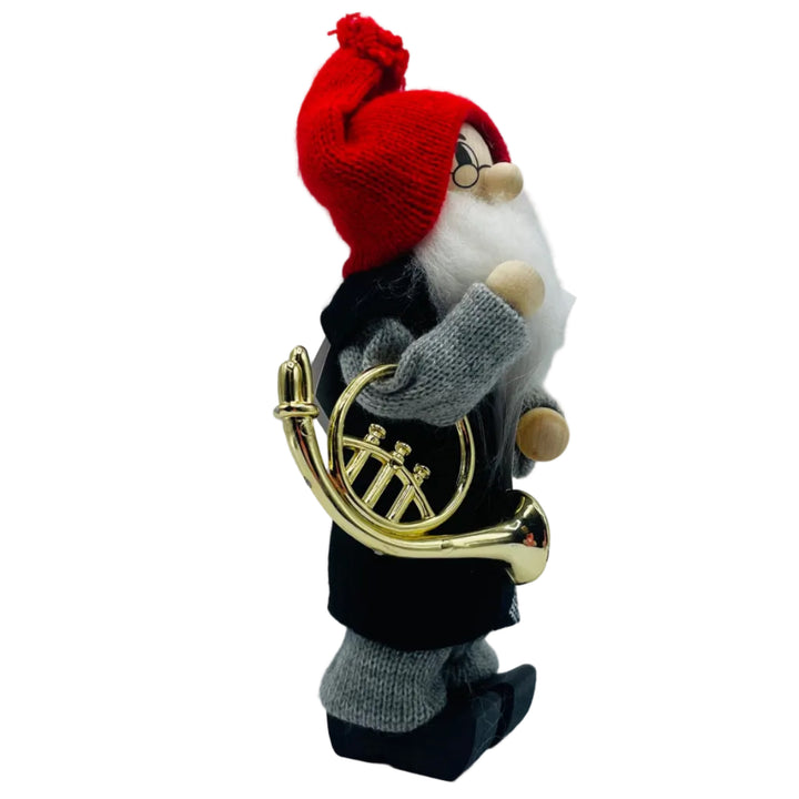 Swedish tomte with French horn and sheet of music