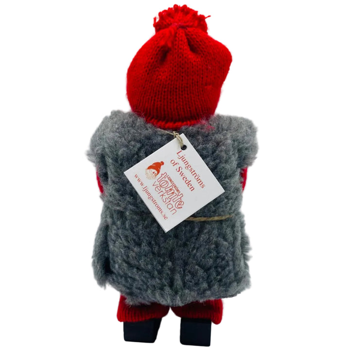Swedish tomte holding a burlap sack