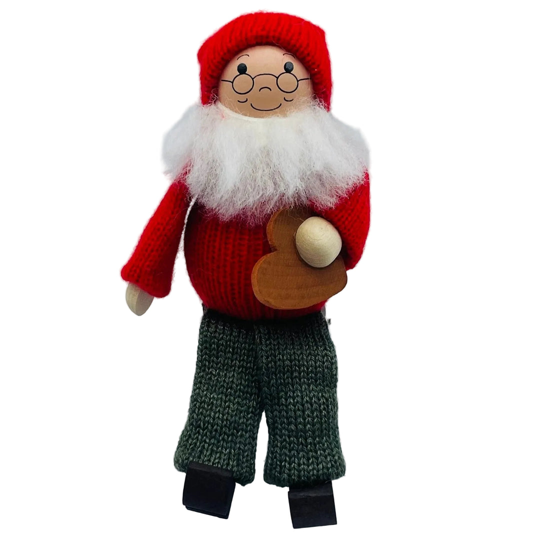 Swedish tomte holding heart cookie