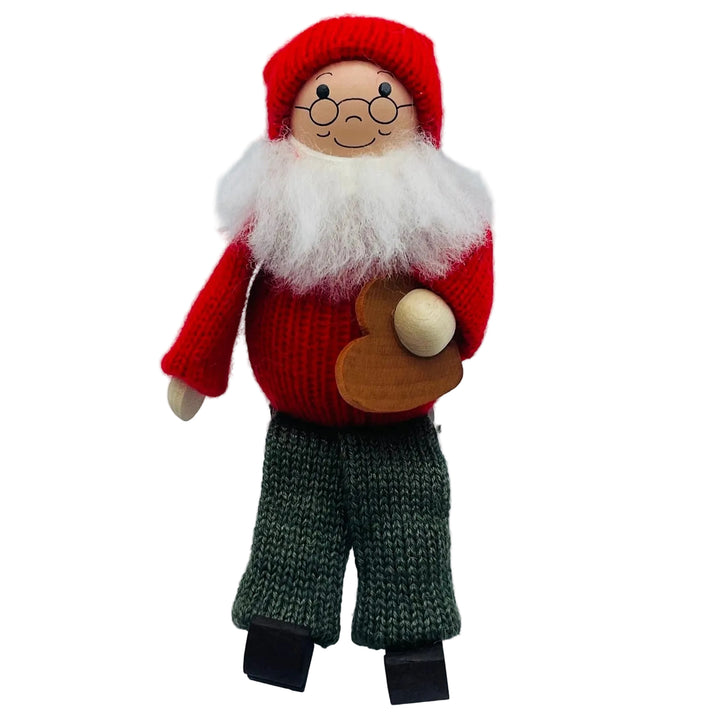 Swedish tomte holding heart cookie
