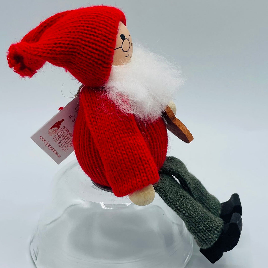 Swedish tomte holding heart cookie