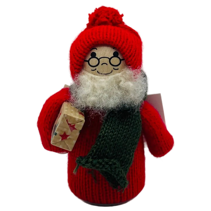 Swedish tomte with present under arm