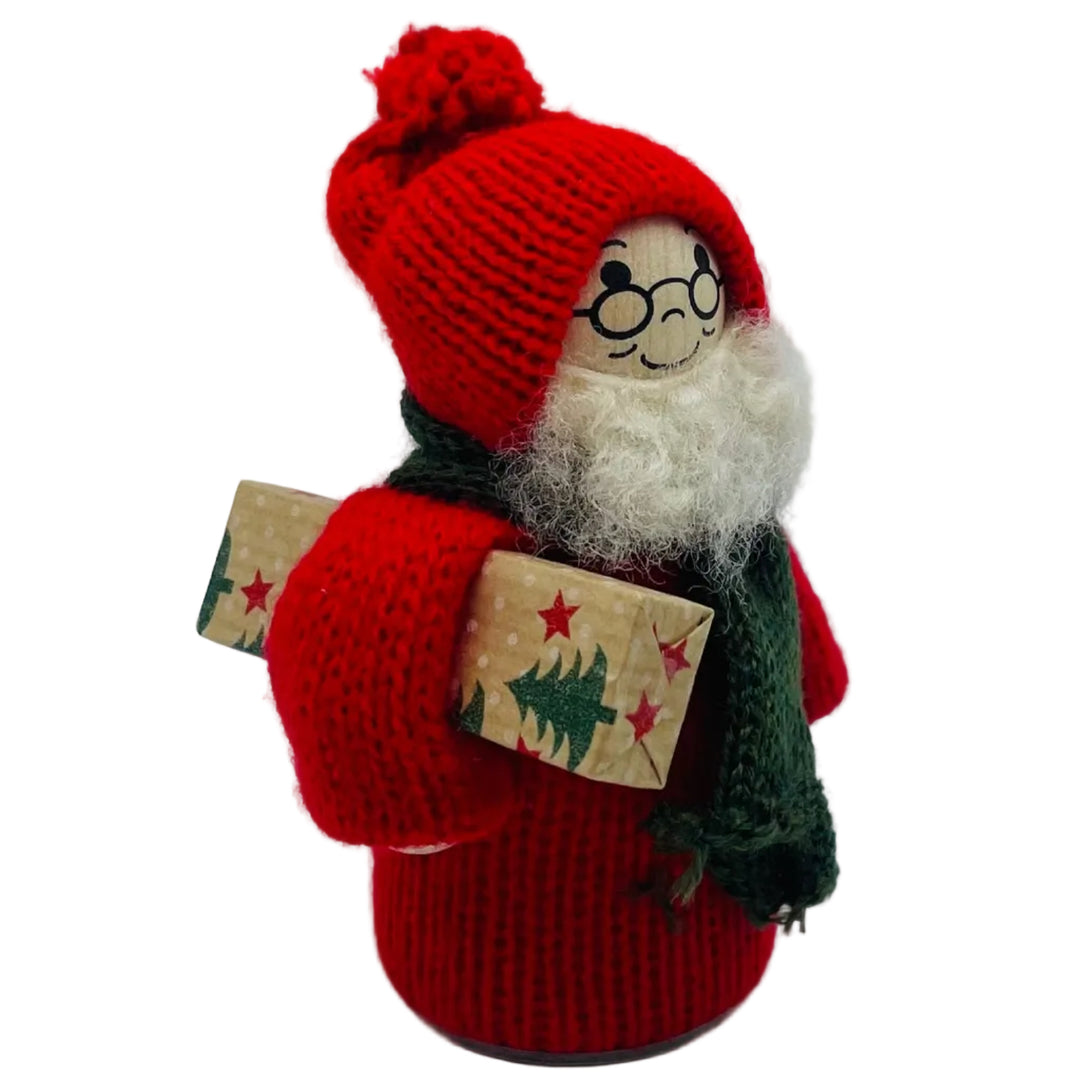 Swedish tomte with present under arm