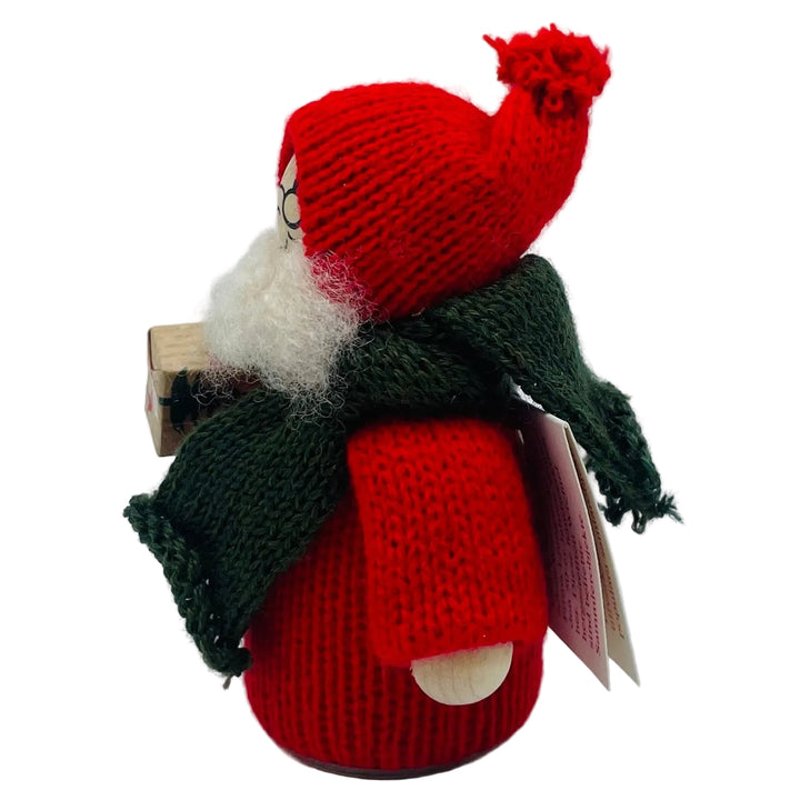 Swedish tomte with present under arm