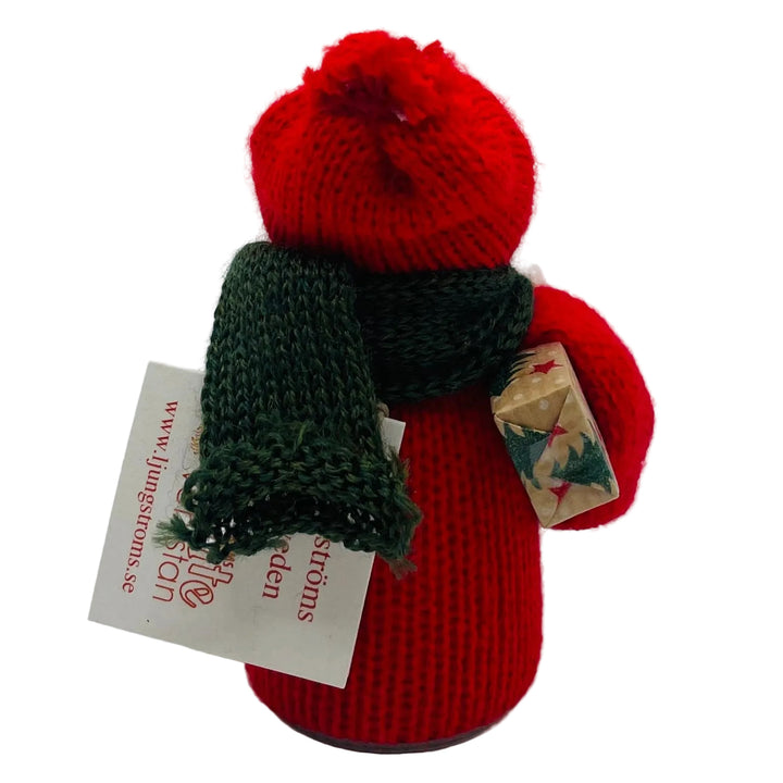 Swedish tomte with present under arm