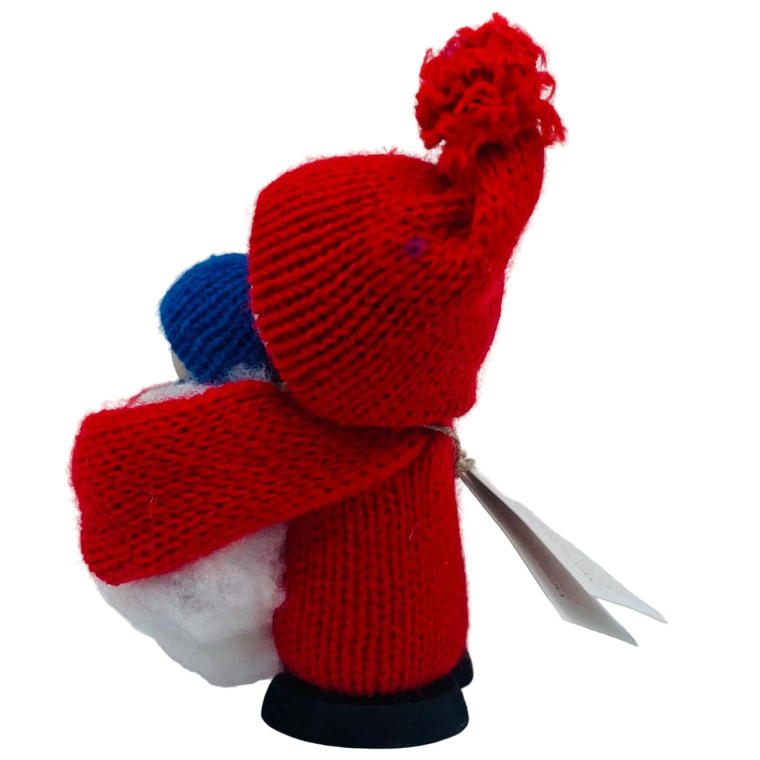 Swedish tomte holding baby