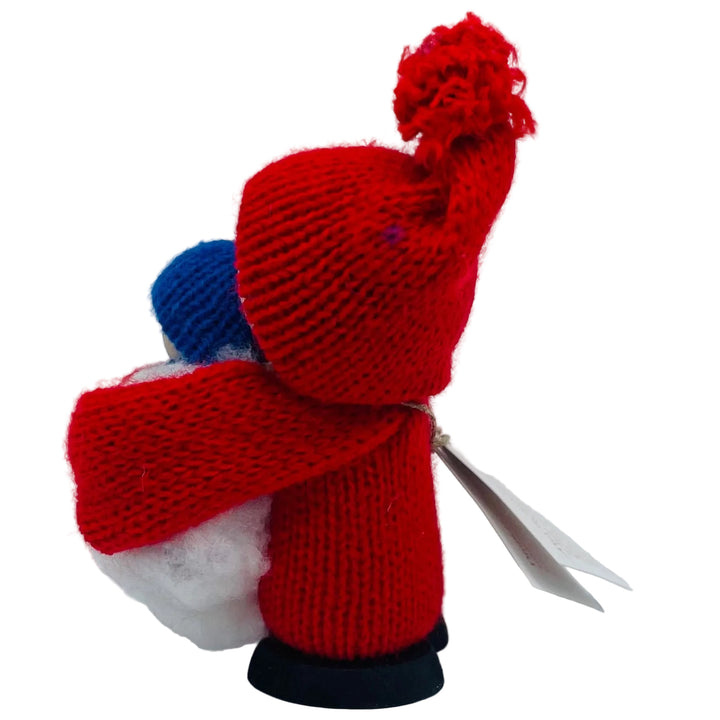 Swedish tomte holding baby