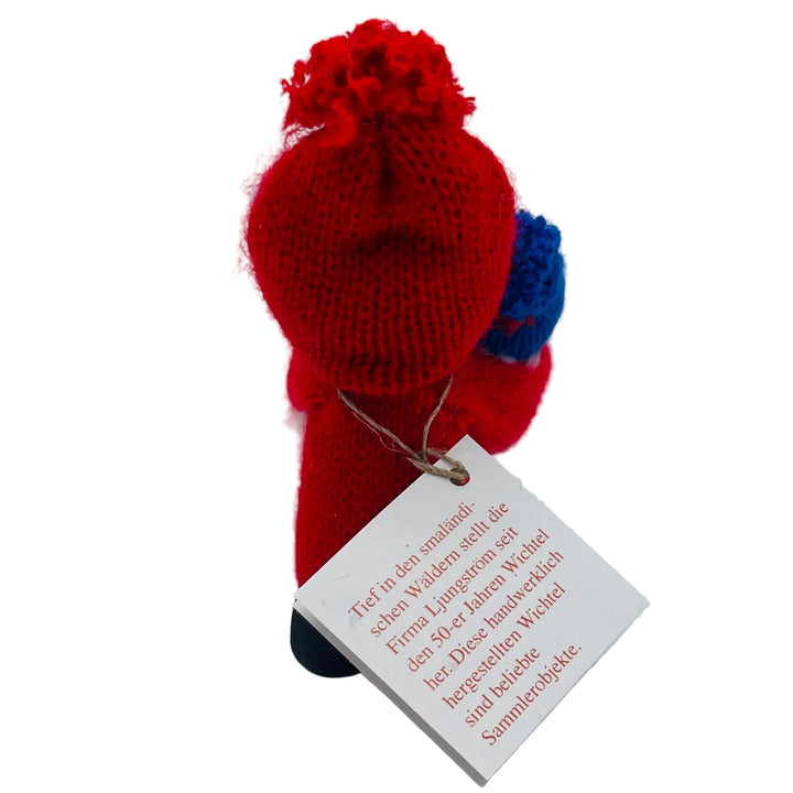 Swedish tomte holding baby