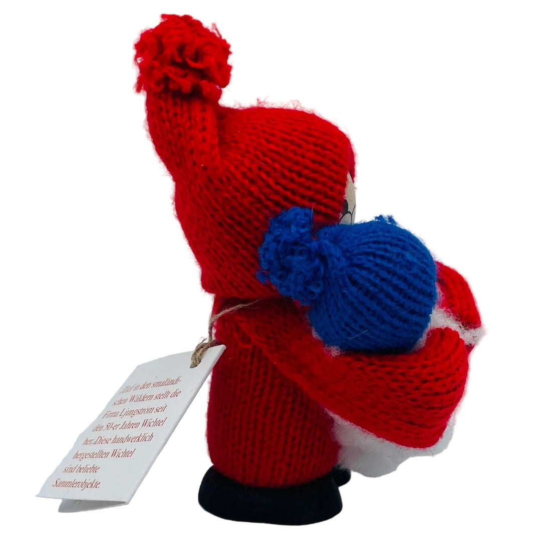 Swedish tomte holding baby