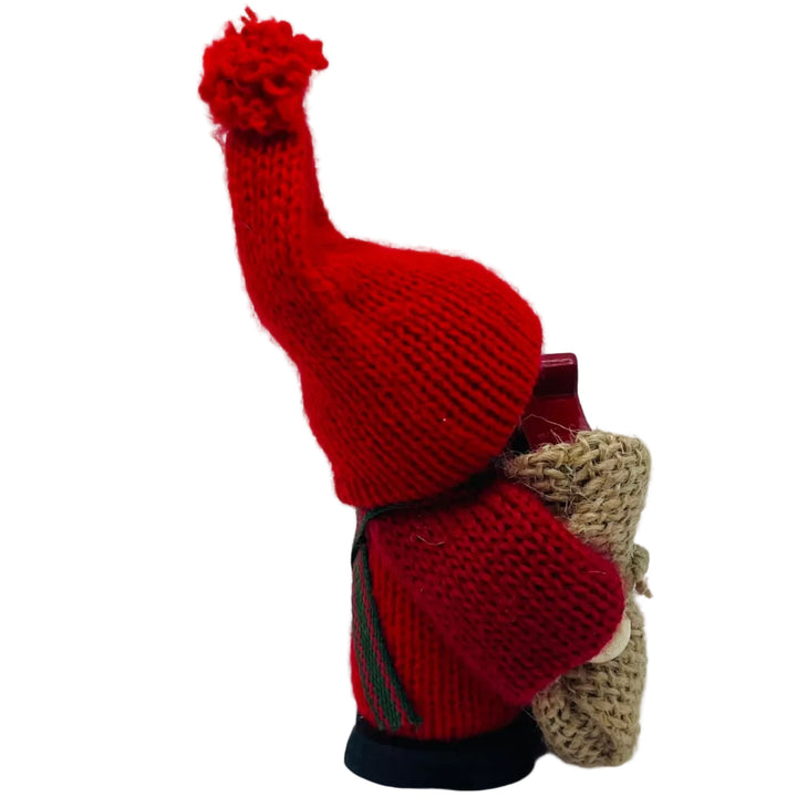 Swedish tomte with Dala horse in burlap sack