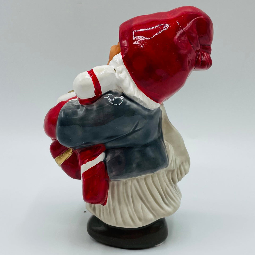 Ceramic Tomte girl carrying presents from Jie