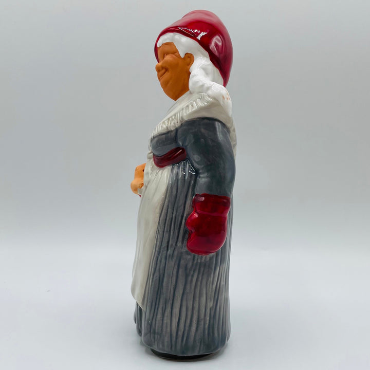 Ceramic Tomte lady carrying pig from Jie