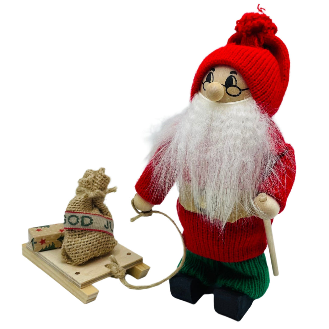 Swedish tomte with sled carrying present & jul sack