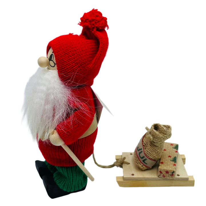 Swedish tomte with sled carrying present & jul sack