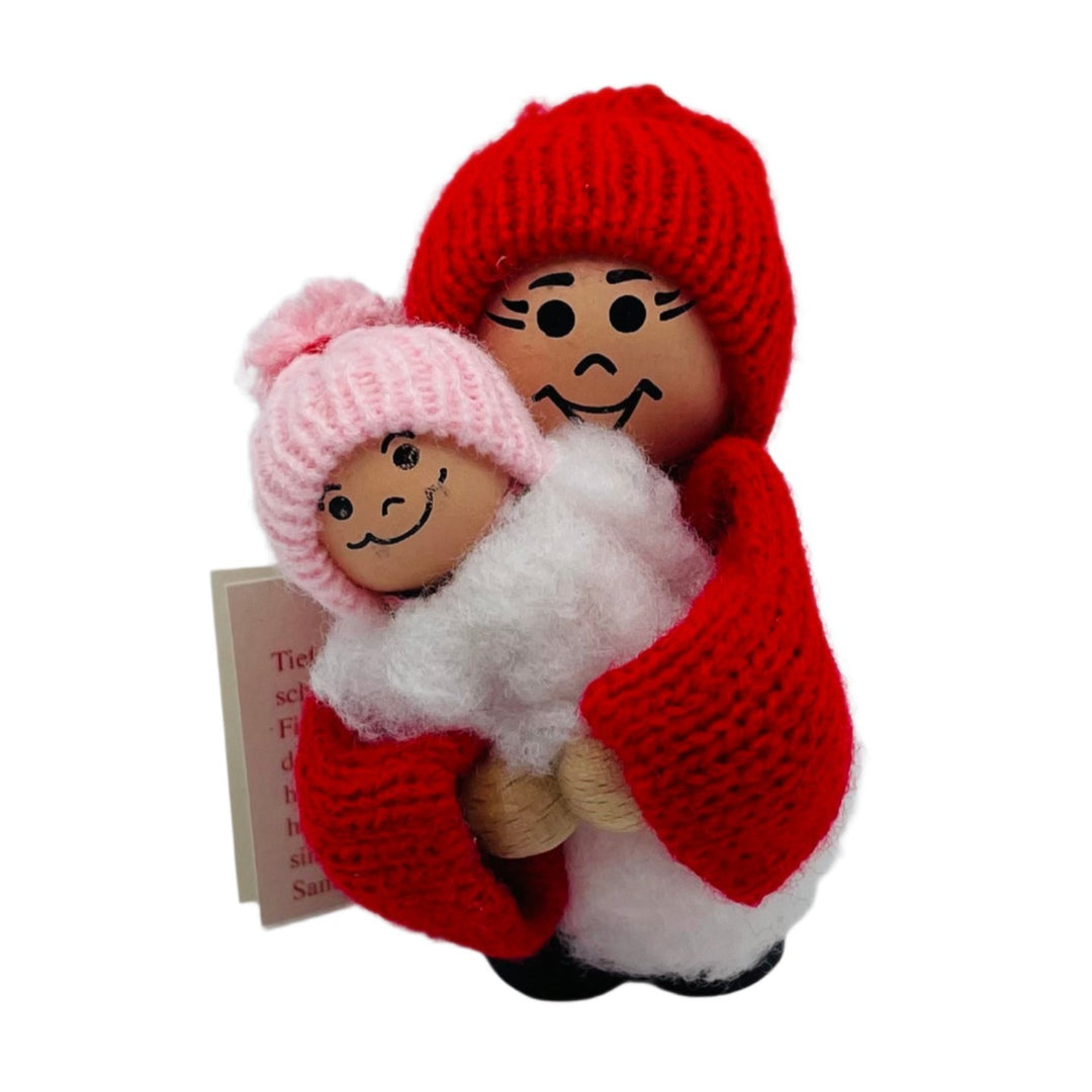 Swedish tomte holding baby