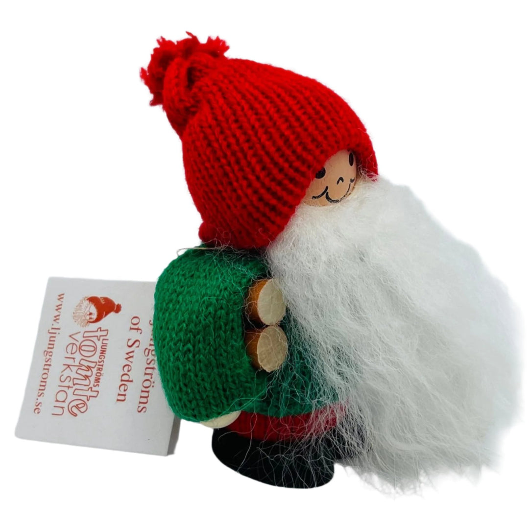 Swedish tomte carrying firewood