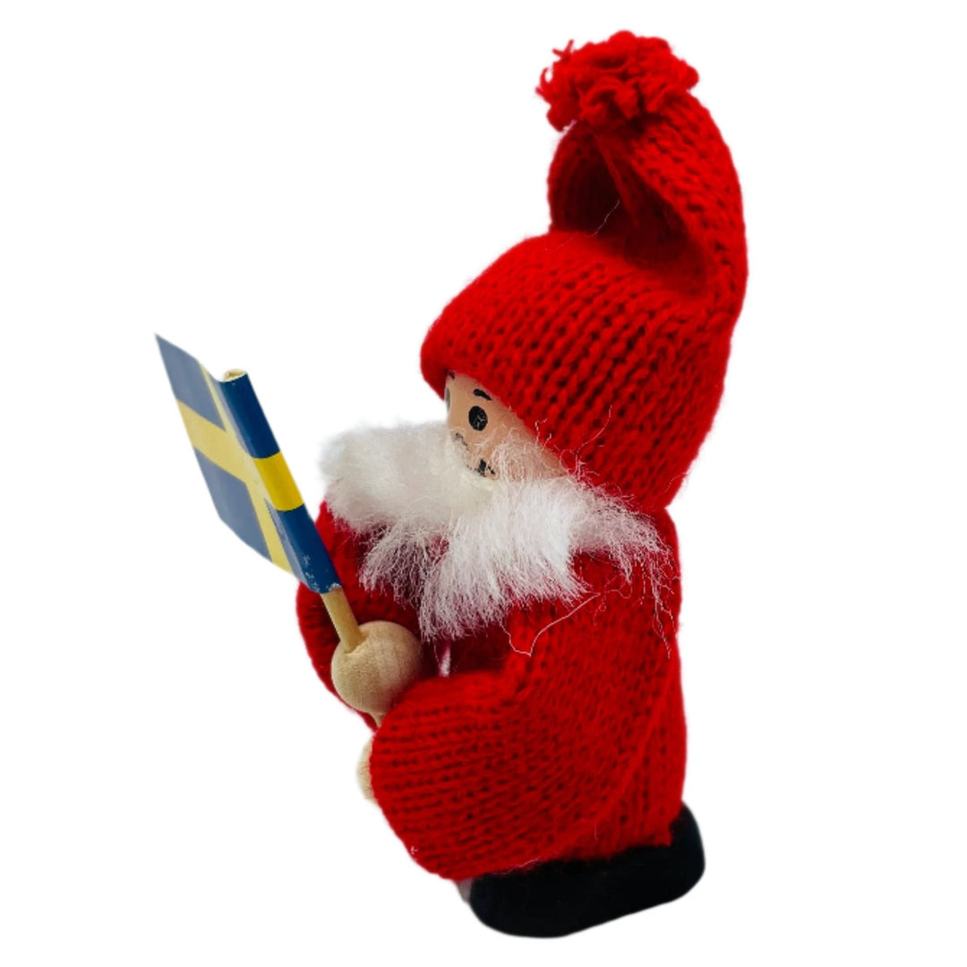 Swedish tomte holding Sweden flag