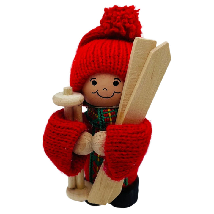 Swedish tomte holding skis and ski poles