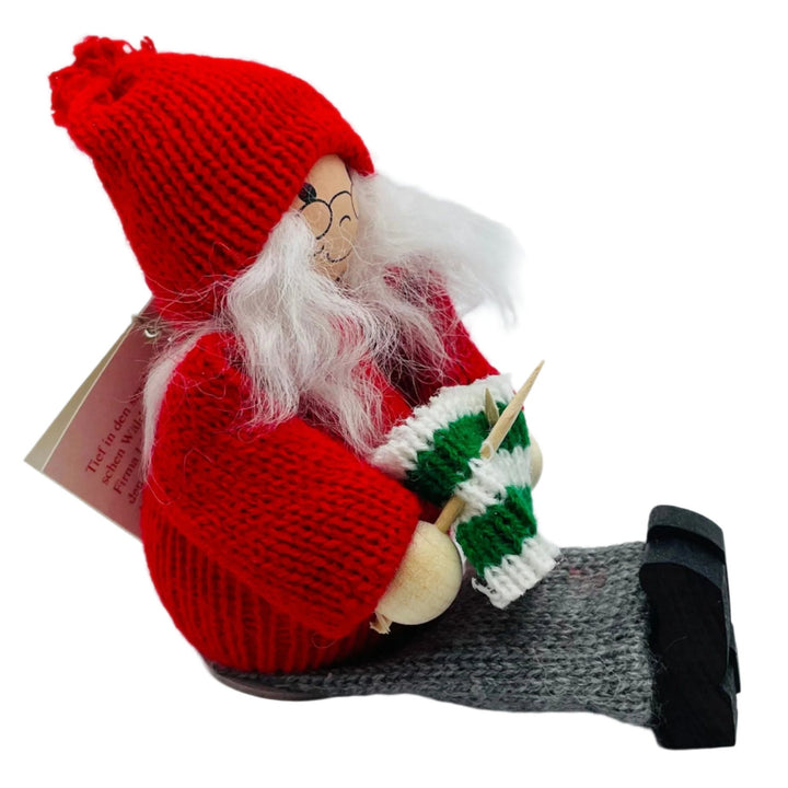 Swedish tomte lady sitting with her knitting