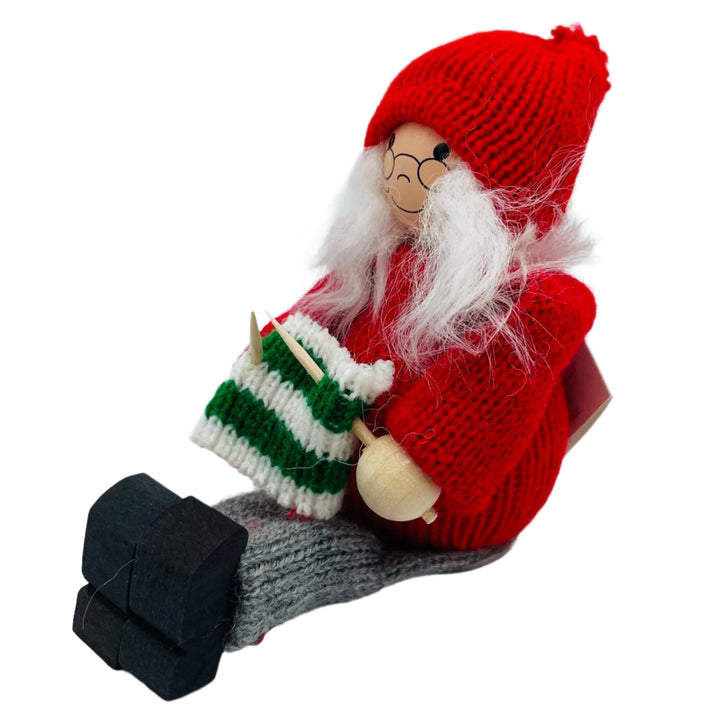 Swedish tomte lady sitting with her knitting