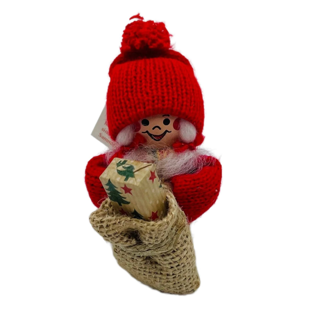 Swedish tomte lady with gift in sack