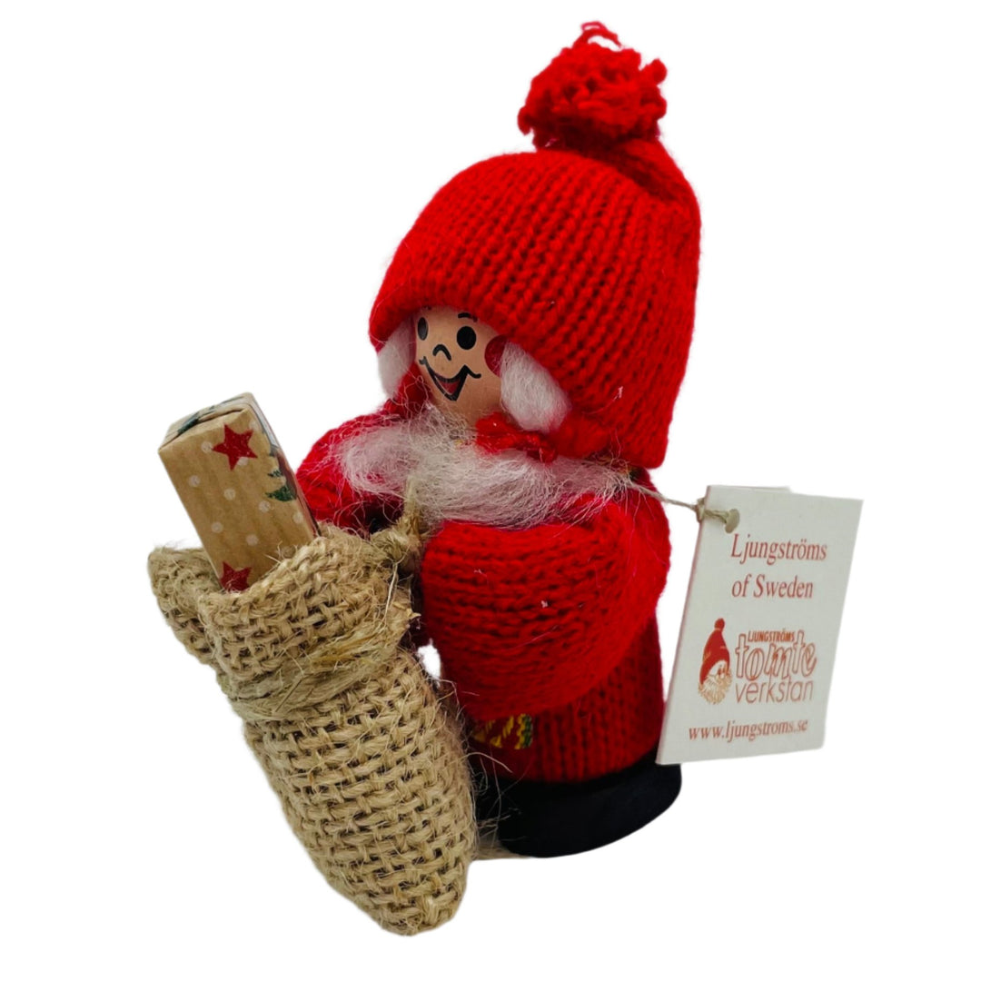 Swedish tomte lady with gift in sack