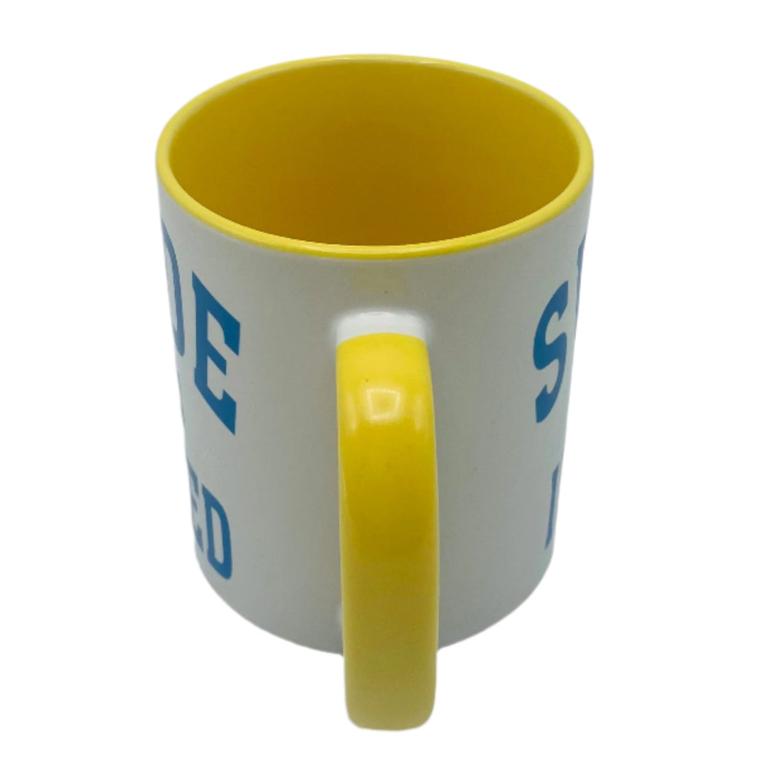 Swede Indeed coffee mug with yellow handle