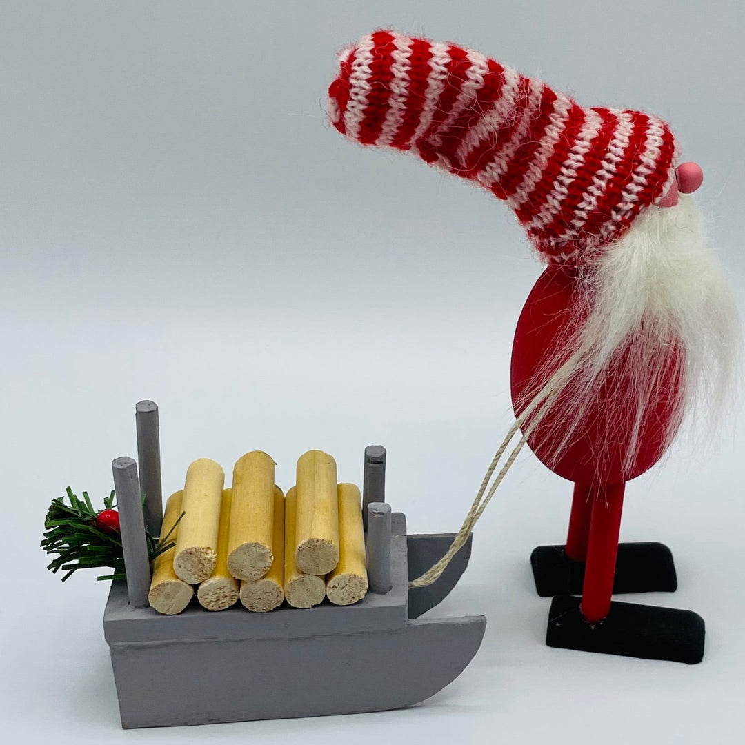 Hand made Tomte pulling Sled with logs