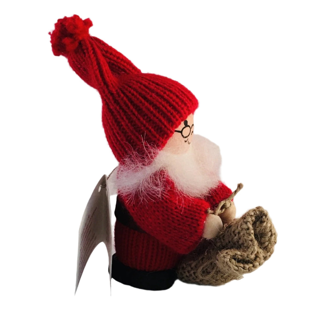 Swedish tomte holding a burlap sack