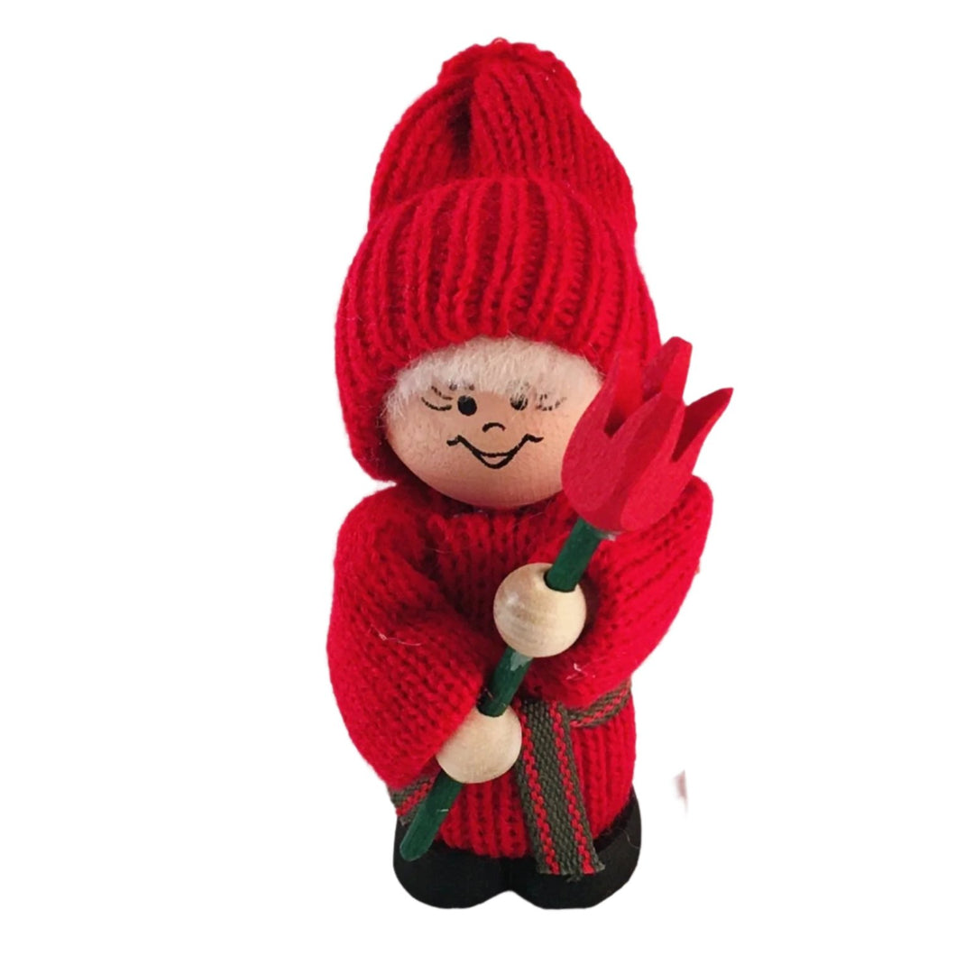 Swedish tomte holding a red tulip