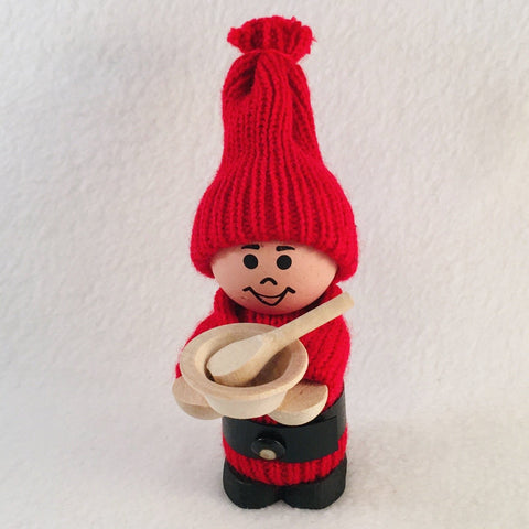 Swedish tomte holding bowl with spoon
