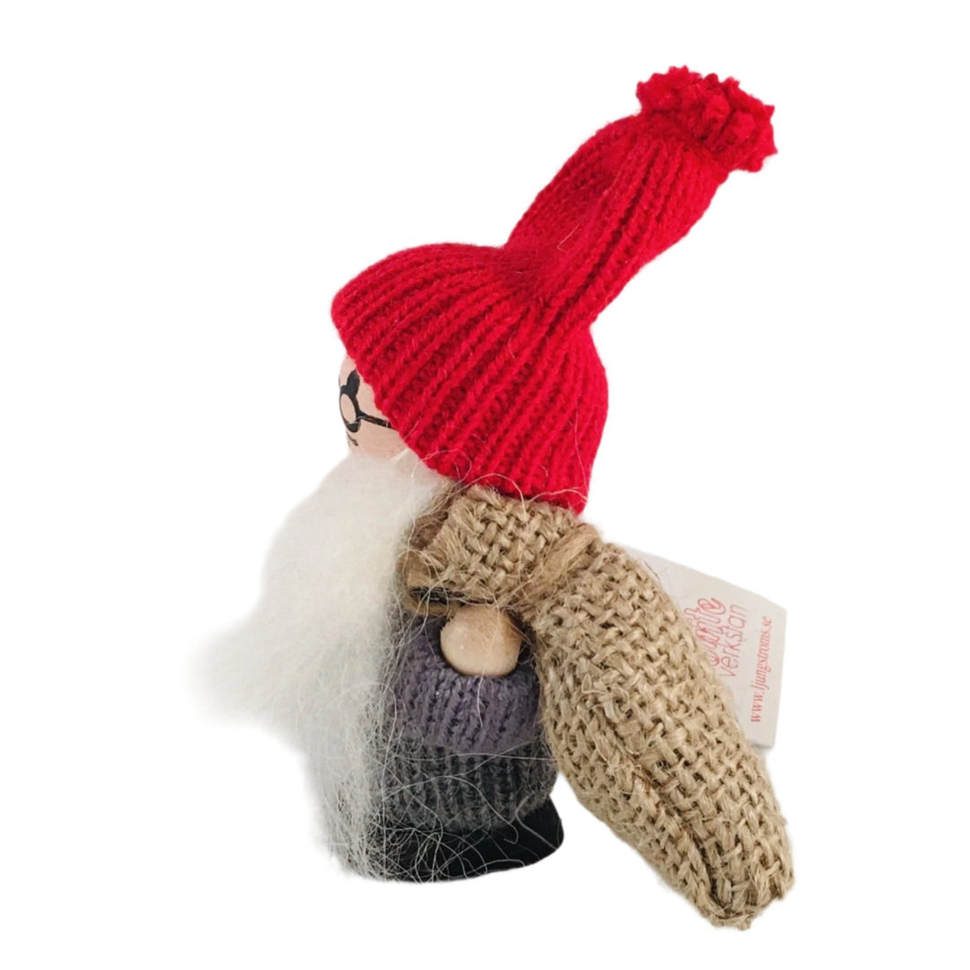 Swedish tomte holding a burlap sack