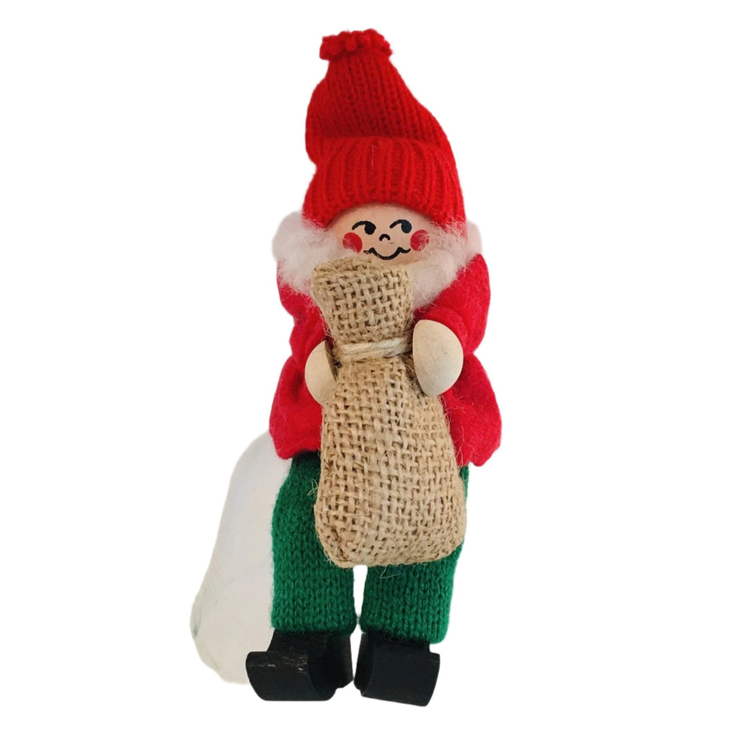 Swedish tomte sitting with burlap sack