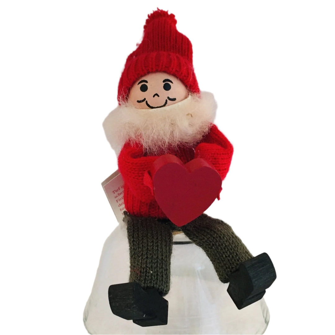 Swedish tomte holding heart