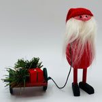 Hand made Tomte pulling sled with 3 gifts & greenery