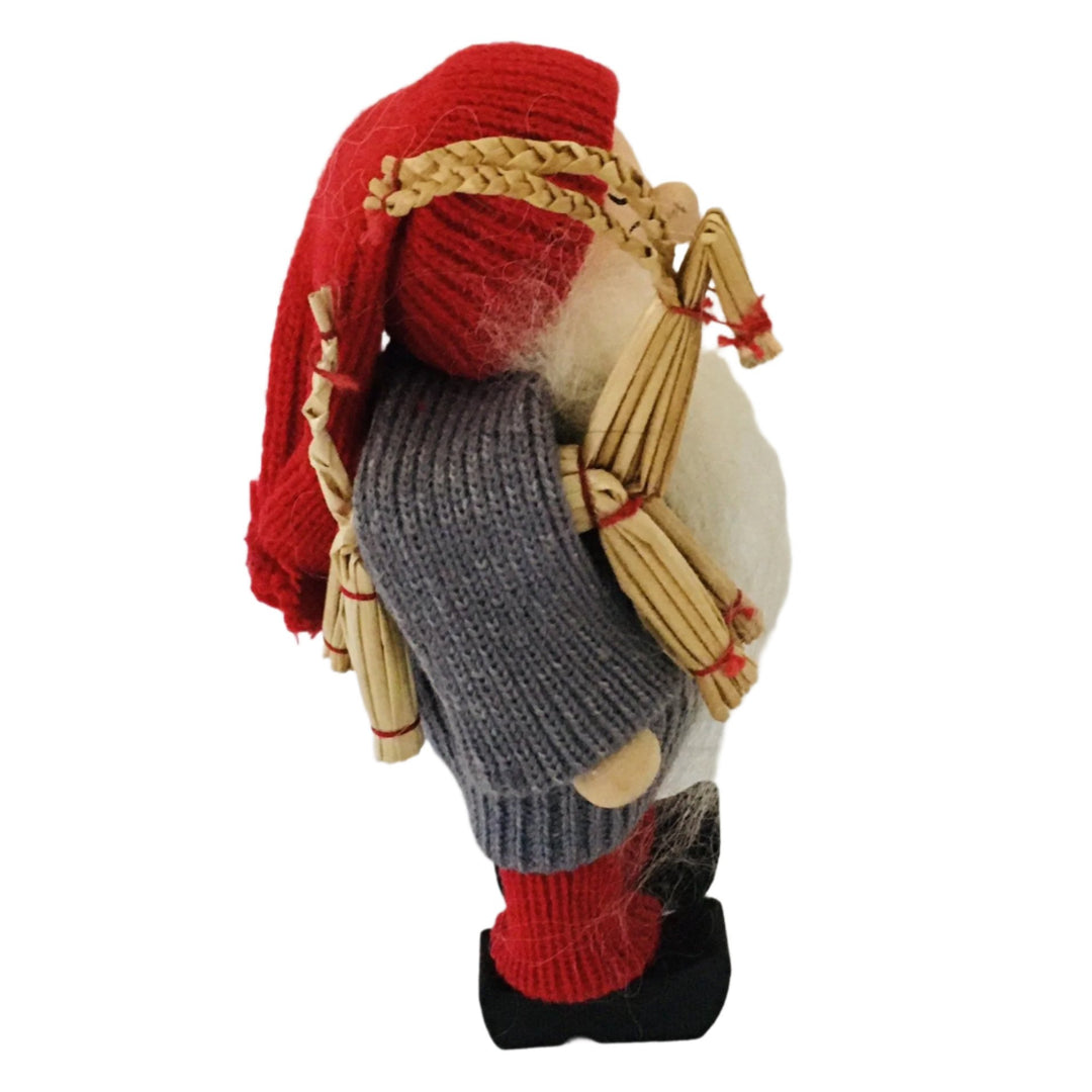 Swedish tomte holding a straw goat