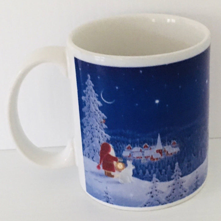 Eva Melhuish Santa and bunny overlooking village coffee mug