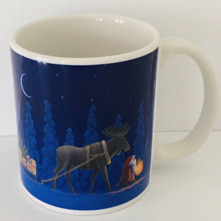 Eva Melhuish Moose pulling sled coffee mug