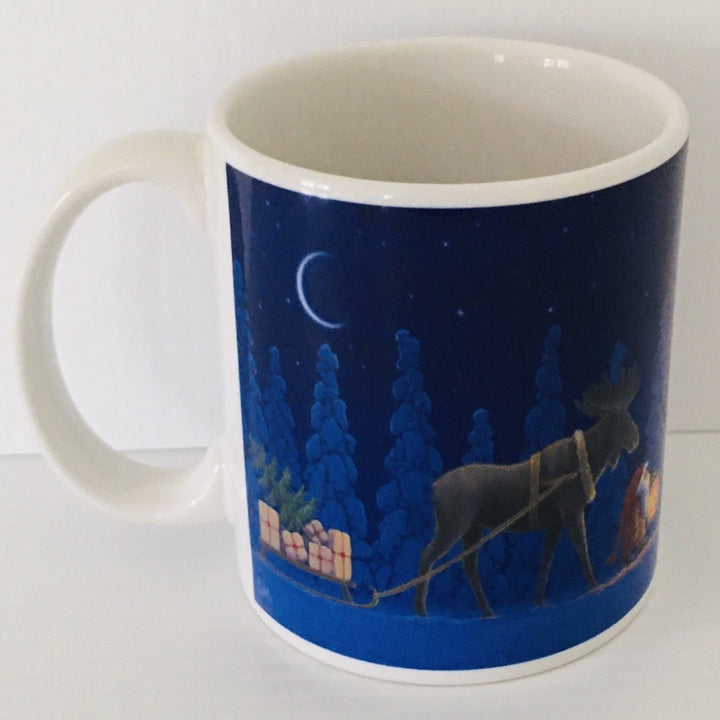 Eva Melhuish Moose pulling sled coffee mug