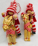 Gnomes riding straw goat ornaments pair