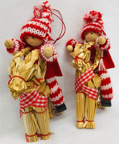Gnomes riding straw goat ornaments pair