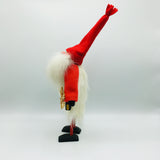 Hand made tomte holding a lantern, snowflake ornament & gift