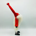 Hand made tomte holding a lantern, snowflake ornament & gift